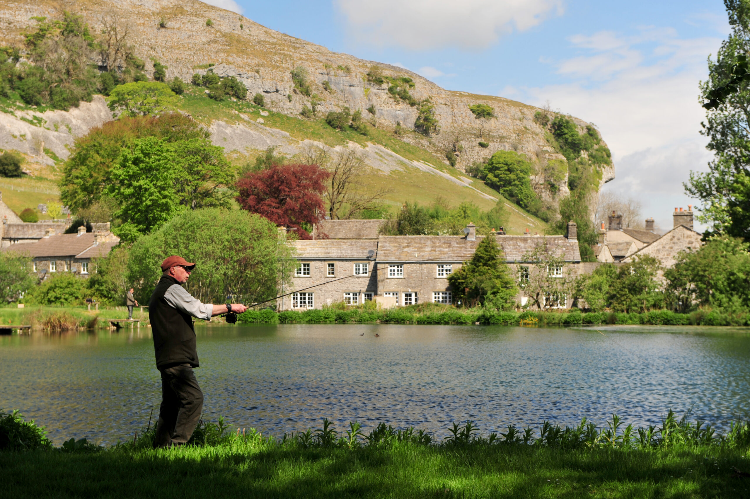 Image showing a fisherman at Kilnsey Park fishing lakes in the Yorkshire Dales.